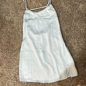Pacsun mini light blue dress with a mini slit on the left leg and an open back.